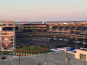 Photo of Nationals Park, with logo of All Star Game and sign flashing Opening Day